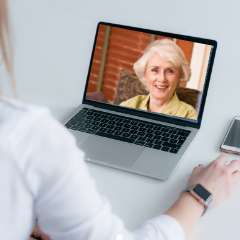 people on video call on laptop