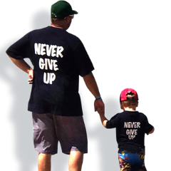 Man and young boy holding hands wearing MND NSW never give up tshirts